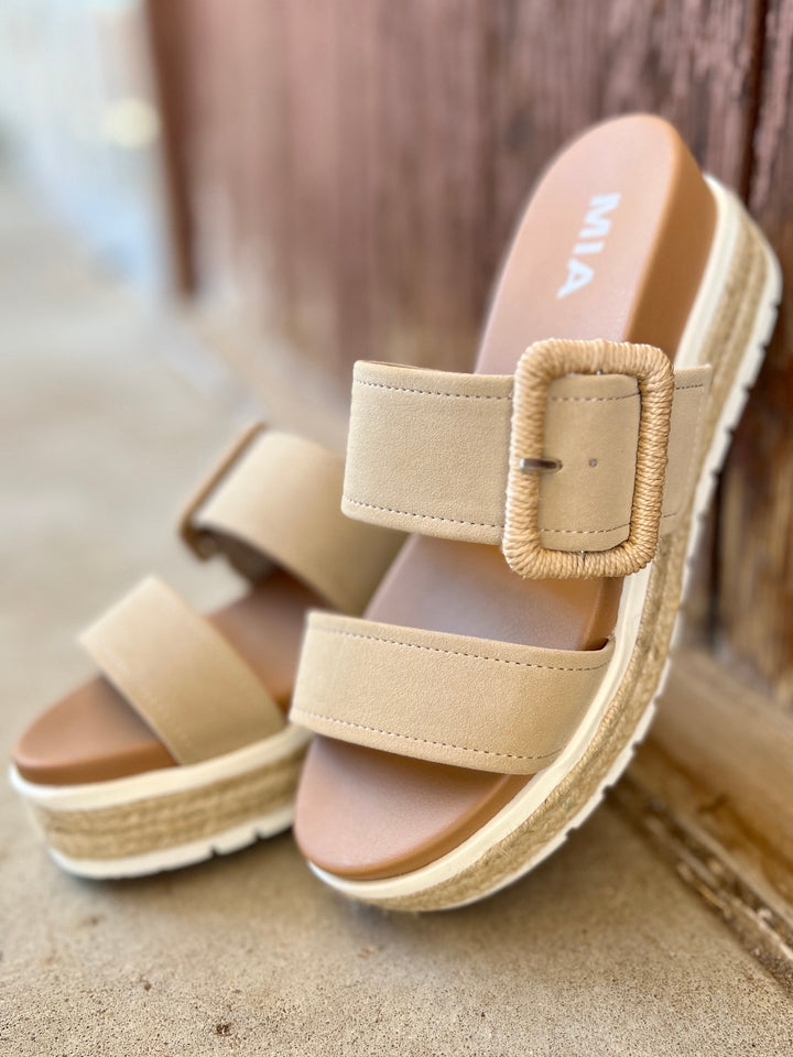 Suede Sand Raffia Platform Sandals | Gussied Up Online Suede sandal. Platform sandal. Neutral color sandal. Fashion trends. Women's shoes. Women's sandals. Women's style. Casual sandal. Women's casual footwear. Spring shoes. Summer shoes. Raffia sandals. Comfortable women's platform sandals. Style. Shoes. Fashion.