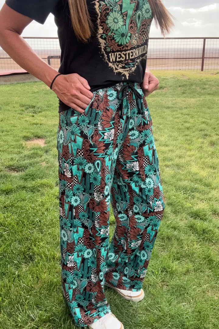 Sterling Kreek Tattoos In Turquoise Pants